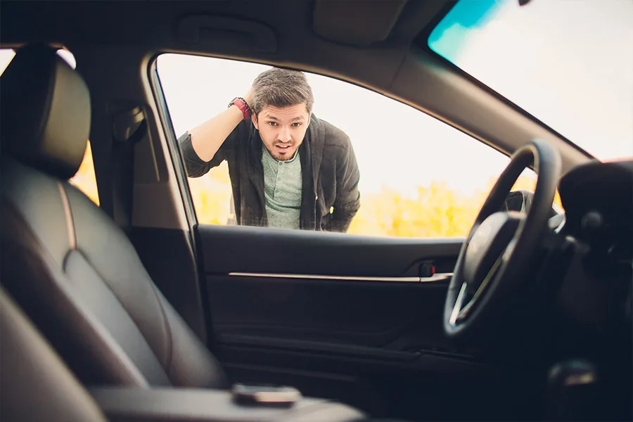 locked-keys-in-car Towing in Eugene - Man looking through car window locked out